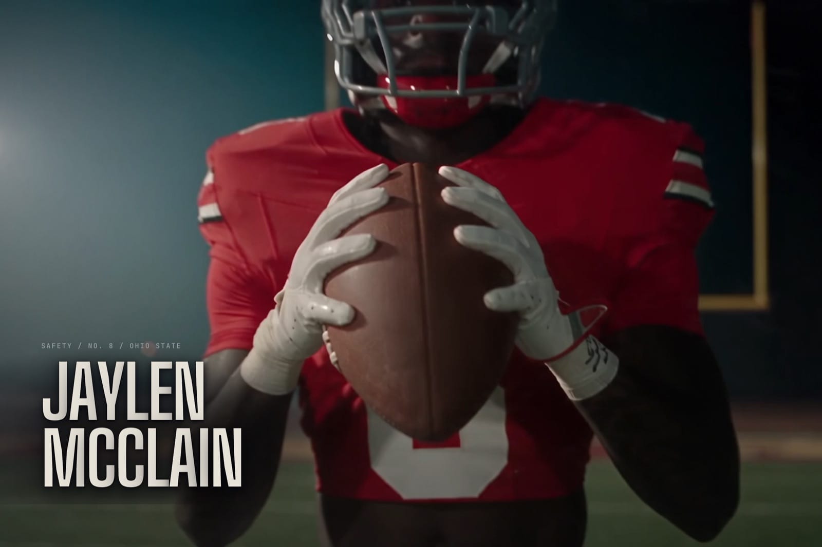 Jaylen McClain homepage with his name over a photo of him holding a football